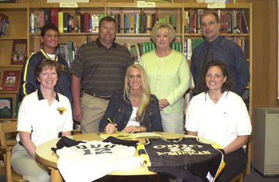 St. Marys standout Krissy Haines, seated center, will try two sports next season at Ohio Dominican. ODU volleyball coach Sandy Rowley, left, and basketball coach Kate Cummings are seated with Krissy. Standing in the back are, from left, St. Marys volleyball coach Monica VanderHorst, parents Rick and Linda Haines and St. Marys basketball coach-athletic director Bruce Brown.<br>dailystandard.com