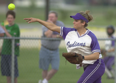 Fort Recovery third baseman Krystal Rammel fires the ball to first base for an out during the Indians' Division IV sectional finals contest against St. Henry on Monday at New Bremen. Rammel went 2-for-2 with two RBI in leading the Indians to a 7-5 victory over the Redskins.<br>dailystandard.com