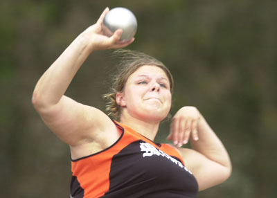 Minster's Mindy Hackemoeller releases the shot put during action from Tuesday's MAC meet.<br>dailystandard.com
