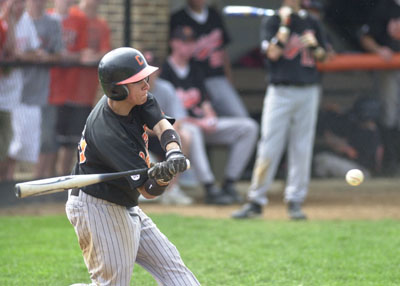 Minster's Scott Sherman shined on the mound and at the plate on Monday in Division IV district semifinals action at Minster. Sherman pitched a two-hit shutout with 12 strikeouts to go along with two hits and one RBI at the plate in the Wildcats' 3-0 win over Marion Local.<br>dailystandard.com