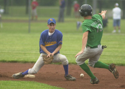Celina's Caleb Byrley, right, advances to second base as St. Marys' Mark Riesen is unable to handle the throw from a teammate during Wednesday's ACME contest at K.C. Geiger Park.<br>dailystandard.com
