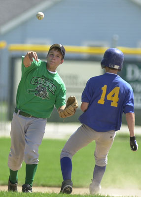 Celina's John Bonvillan, left, throws to first as St. Marys' Austin Soloman comes to the bag during Saturday's doubleheader.<br>dailystandard.com