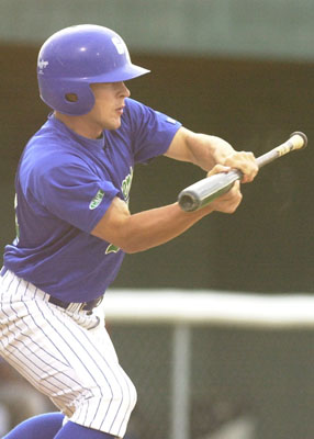 Grand Lake's Jon Hatfield squares around to bunt during the Mariners' game against the Portland Rockets on Tuesday night at Jim Hoess Field. Portland defeated Grand Lake, 7-2.<br>dailystandard.com