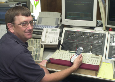 Mercer County 911 Administrator Monte Diegel sits before a computer that helps dispatchers send law enforcement officers, firefighters and rescue squad personnel. The system needs upgraded with one aspect of the work involving the installation of equipment that would pinpoint the location of cell phone calls.<br>dailystandard.com