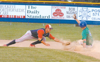 Grand Lake's Aaron Bulkley, right, slides into second with a stolen base ahead of the tag from Columbus' Matt Repec. Bulkley had four hits, but the Mariners lost to the All Americans, 8-2.<br>dailystandard.com