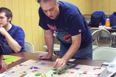 Richard Warren of Minster plays in the Hero Clix tournament on Saturday at Cards-n-Stuff on Logan Street in Celina. The game, which has gained national attention, uses super hero figures.<br>dailystandard.com