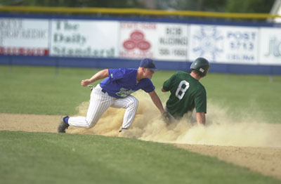 Grand Lake's Dusty Hammond, left, puts the tag on Stark County's Adam Witter during Monday's doubleheader at Jim Hoess Field. Witter was safe with a double.<br>dailystandard.com