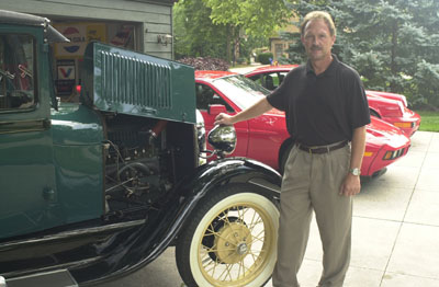 Ken Bigham of Celina stands beside the 1929 Ford Model A Tudor that he restored during an ambitious three-year project. The car, which has been in his family for 45 years, will be among hundreds on display Saturday at the 34th annual Collector Car Show during the Celina Lake Festival.<br>dailystandard.com