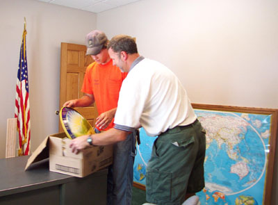 Coldwater village summer employee Brent Schwieterman and Village Manager/Engineer Eric Thomas work in the mayor's office in the village's new Municipal Center.<br>dailystandard.com