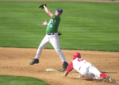 Grand Lake's Dusty Hammond, left, catches the ball at second base and tries to make a tag on a Columbus baserunner during GLSCL playoff action. Hammond had three hits, but the Mariners  committed six errors in an 8-3 loss.<br>dailystandard.com