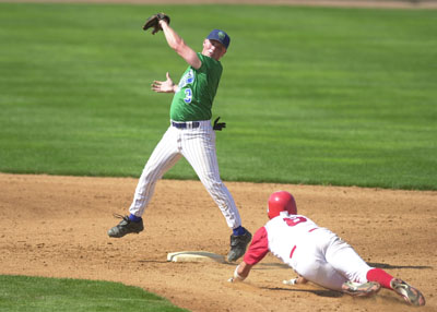 Grand Lake's Dusty Hammond, left, catches the ball at second base and tries to make a tag on a Columbus baserunner during GLSCL playoff action. Hammond had three hits, but the Mariners  committed six errors in an 8-3 loss.<br>dailystandard.com