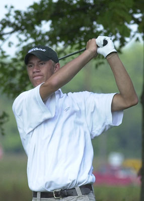 Celina's Scott Luthman watches his shot during Monday's Western Buckeye League dual match against Lima Shawnee at Fox's Den Golf Course. Luthman shot a 41 in the Bulldogs' win.<br>dailystandard.com