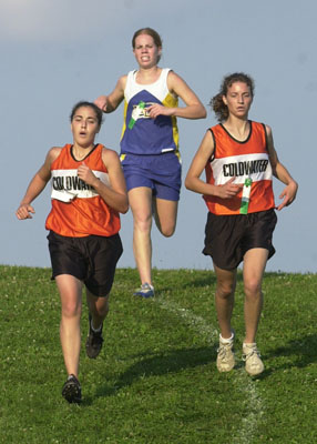 Coldwater teammates Tasha Stucke, left, and Jill VonderHaar get in front of Marion's Trisha Bruns during Tuesday's Mercer County Invitational at Eastview Park. Stucke placed first with Bruns finishing second.<br>dailystandard.com