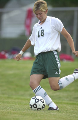 Celina's Shay Adams tries to pass to a teammate during Monday's game against Kenton. Adams scored two goals in Celina's 7-0 win over Kenton.<br>dailystandard.com