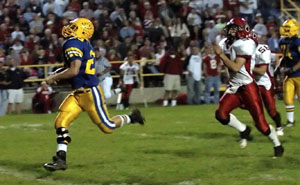 St. Marys' Justin Nagel, left, runs in the open field away from the Kenton defense on his way for a 57-yard touchdown to seal the game for the Roughriders in the fourth quarter. Nagel ran the ball just 14 times but totaled 132 yards and three touchdowns to lead the Roughriders to a 33-15 win over the Wildcats. The win, coupled with a Shawnee loss, puts St. Marys back into a first-place tie in the Western Buckeye League with Shawnee.<br>dailystandard.com