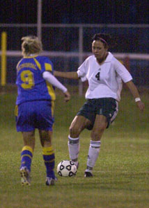 Celina's Heidi Schollmeier, 4, dribbles the ball up the field as St. Marys' Jerra Rupert, 9, closes in on defense. Schollmeier had two goals in Celina's 3-0 win over St. Marys.<br>dailystandard.com