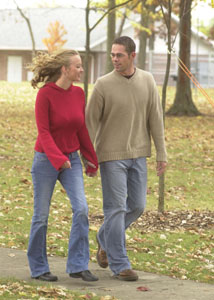 Strolling through the park on an autumn day no longer poses a challenge for Courtney Firks of Coldwater. Firks, shown with boyfriend Matt Siefring, regained the ability to walk after an Oct. 21, 2001 traffic accident left her paralyzed from the waist down. Now a University of Dayton senior, she requires only a short brace on her left leg. <br>dailystandard.com