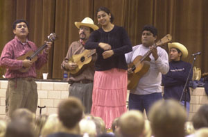 Dancer Rubi Oseguera, of Veracruz, Mexico, dances on a wooden platform for elementary students at Coldwater earlier this week. She is part of the Mexican song and dance group, Chuchumbe, which performed for local students this week and will hold a public performance Saturday at Arts Place in Portland, Ind. <br>dailystandard.com