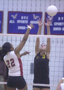 Parkway's Laura Art, 3, tries to block the spike of Rocky River Lutheran West's Helen Stewart, 22, during their Division III regional semifinal match on Thursday at Liberty-Benton High School.<br>dailystandard.com