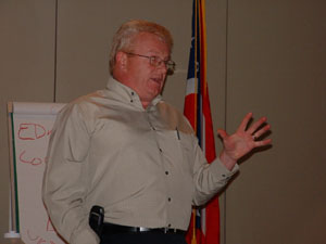 Detective Kip Wright talks to participants at a Junior Scholars program at Wright State University-Lake Campus on Friday -- his last day on the job with the Mercer County Sheriff's Office. He has seen many technological developments -- DNA testing, electronic fingerprint distribution, a 911 emergency system and computerized communication links -- during the course of 32 years in public service.<br>dailystandard.com