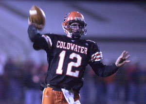 Coldwater quarterback Steve Borger gets ready to let go of the ball. The Cavalier junior threw for 272 yards as the Cavaliers posted a playoff-opening 35-0 win over Avon. Coldwater now plays Delta, who ended the Cavaliers' 2003 season.<br>dailystandard.com