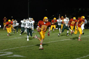 New Bremen's Troy Lammers heads toward the end zone on a 51-yard touchdown run to start Friday's game with Troy Christian on a high note.<br>dailystandard.com