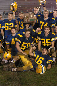 St. Marys players pose for the camera after accepting the Division III regional football championship trophy after Saturday's 21-13 win over Chaminade-Julienne in Troy. The Roughriders play this Saturday against Bishop Watterson at Upper Arlington. More information on this game and St. Henry's playoff can be found starting on page 1B in Sports.<br>dailystandard.com