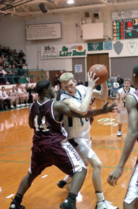 Celina's Nick Grieshop, with ball, tries to make a move on a Linden McKinley player during their game on Friday night at the Fieldhouse. Linden McKinley defeated Celina, 65-57.<br>dailystandard.com