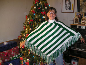 Judy Needham of Mendon works at her knitting machine making ponchos at her rural home. The poncho business started about six months ago simply by word of mouth after she made one for her 7-year-old granddaughter. Now she says she can harly keep up with orders. <br>dailystandard.com