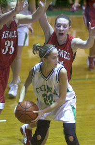 Celina's Allison Hoying, 22, is double-teamed by the Shawnee defense during their game on Thursday night at the Fieldhouse.<br>dailystandard.com