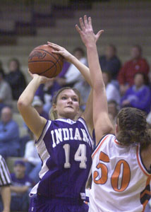 Fort Recovery's Krystal Rammel, 14, shoots over Coldwater's Kendra Robbins, 50, during their Midwest Athletic Conference game on Thursday. Rammel scored a game-high 14 points in Fort Recovery's 52-41 victory over Coldwater.<br>dailystandard.com