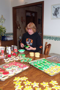 Ruth Dameron, 312 E. Elizabeth St., Coldwater, decorates another  batch of Christmas cookies bound for friends, neighbors and co-workers. Each year she makes 150 dozen cutout cookies in keeping with a 20-year tradition. Her mother used to do the same thing in Midland, Mich.<br>dailystandard.com
