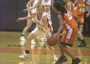 Coldwater's Renee Hemmelgarn, 11, applies defensive pressure on Elida's Rosie Paris, with ball, during their nonconference game on Tuesday night. Coldwater defeated Elida 49-48 to improve to 6-2 on the year.<br>dailystandard.com