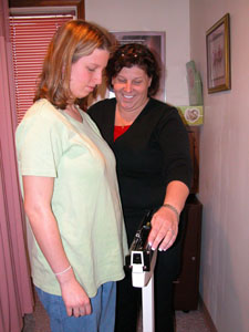 Seventeen-year-old Jessica, a current resident at Harbor House in Celina, is weighed in by ministry coordinator and house mother Karla Eberle. Jessica, who is six months pregnant, lives with the Eberles in the maternity home on East Fulton Street.<br>dailystandard.com
