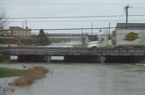 Water from Grand Lake St. Marys spills over the West Bank spillway into the Beaver Creek, which was out of its banks this morning. The lake was reported as 12 inches above normal lake level this morning. Local weather forecaster Dennis Howick has reported 2.38 inches of precipitation since Jan. 1 and predicts freezing rain, sleet and snow today and tonight.<br>dailystandard.com