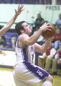 Fort Recovery's Greg Faller drives to the basket during the Indians' game against New Knoxville on Friday night. Faller had 10 points in the Indians' 65-56 win.<br>dailystandard.com