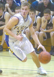 Ryan Winner drives towards the hoop during Monday's game. The Marion senior scored 13 in the Flyers 50-43 loss to Spencerville.<br>dailystandard.com