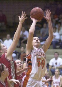 Coldwater's Kendra Robbins, 50, goes strong to the basket for two of her 14 points against New Knoxville on Thursday night. The Rangers defeated the Cavaliers, 58-47.<br>dailystandard.com