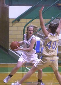 Celina's Meg Smalley, with ball, makes a move baseline on Bath's Alyssa Schiele, 40, during their Western Buckeye League game on Thursday night at the Fieldhouse.<br>dailystandard.com