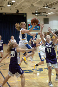 Marion Local's Maria Moeller soars to the hoop for two of her 21 points as the Flyers remain unbeaten this season.<br>dailystandard.com