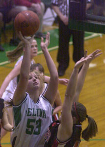 Celina's Liz Homan, 53, scores in the low post over a Bellefontaine defender during Monday's game at the Fieldhouse. Homan scored 13 points in the Bulldogs' 61-54 victory.<br>dailystandard.com