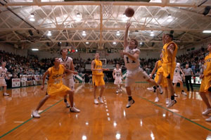 Celina's Seth Staugler, 11, weaves through the Ottawa-Glandorf defense for two of his game-high 14 points during Friday's Western Buckeye League game at the Fieldhouse. Celin defeated Ottawa-Glandorf, 47-40 to stay atop the WBL standings along with Elida, St. Marys and Van Wert.<br>dailystandard.com