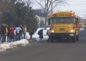 Celina students get on their bus Friday morning at their Sugar St bus stop. It was only the second day of classes this week for Celina students and the first day classes weren't delayed by fog. Celina students will make up at least three days at the end of the year after missing eight total days so far this year. Many other area school districts also have reached or exceeded the state limit of five days.<br>dailystandard.com