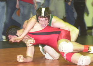 Celina's Jantzen Hinton takes down Kenton's Theron Dunson in an early round match. Hinton won his second straight WBL title on Saturday to help the MatDogs win a share of the overall title for the first time in the program's history.<br>dailystandard.com