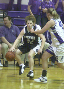 Parkway's Abbea Hoehammer, 42, tries to drive but Fort Recovery's Kelly Link, right, cuts her off on the baseline during Thursday's Midwest Athletic Conference matchup. Fort Recovery won the game, 62-25.<br>dailystandard.com