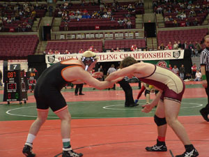 Coldwater's Kyle Oswalt, left, gets ready to confront his opponent during the state wrestling meet on Thursday at the Schottenstein Center. Oswalt won a match on Thursday afternoon which was the first state wrestling victory in Cavalier school history.<br>dailystandard.com