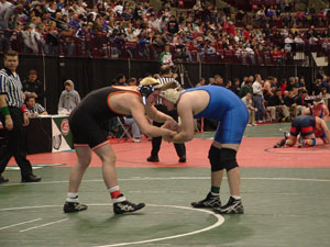 Coldwater's Kyle Oswalt, left, gets ready to tangle with an opponent during the state wrestling meet on Friday at the Schottenstein Center in Columbus. <br>dailystandard.com