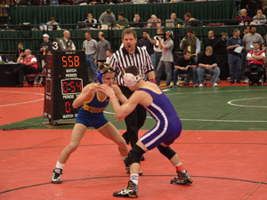 St. Marys' Caleb Cisco, on left, gets ready to engage with an opponent during Friday's Division II state wrestling tournament. Cisco advanced to Saturday's action after picking up two wins on Friday.<br>dailystandard.com