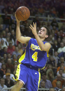 St. Marys' Tom Burke goes to the basket for two of his 11 points during the Division II regional semifinal on Wednesday at Savage Hall in Toledo. St. Marys lost to Upper Sandusky, 83-74.<br>dailystandard.com