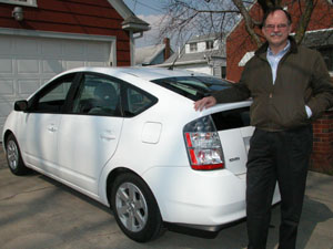 Craig Klopfleisch of Celina proudly stands next to his hybrid car, a 2004 Toyota Prius, purchased in May last year. As gasoline prices rise, more motorists are taking interest in vehicles like the Prius that are powered by sources other than gasoline and get a much higher miles per gallon ratio.<br>dailystandard.com